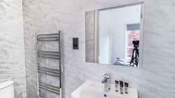 Shower, hair dryer, towels