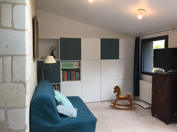 Smart TV, fireplace, video-game console, foosball