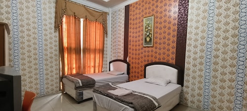 Hotel O Wisma Hamalau SyariahNearPulau Bromo Pedestrian Bridge