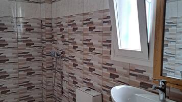 Shower, hair dryer, towels, toilet paper