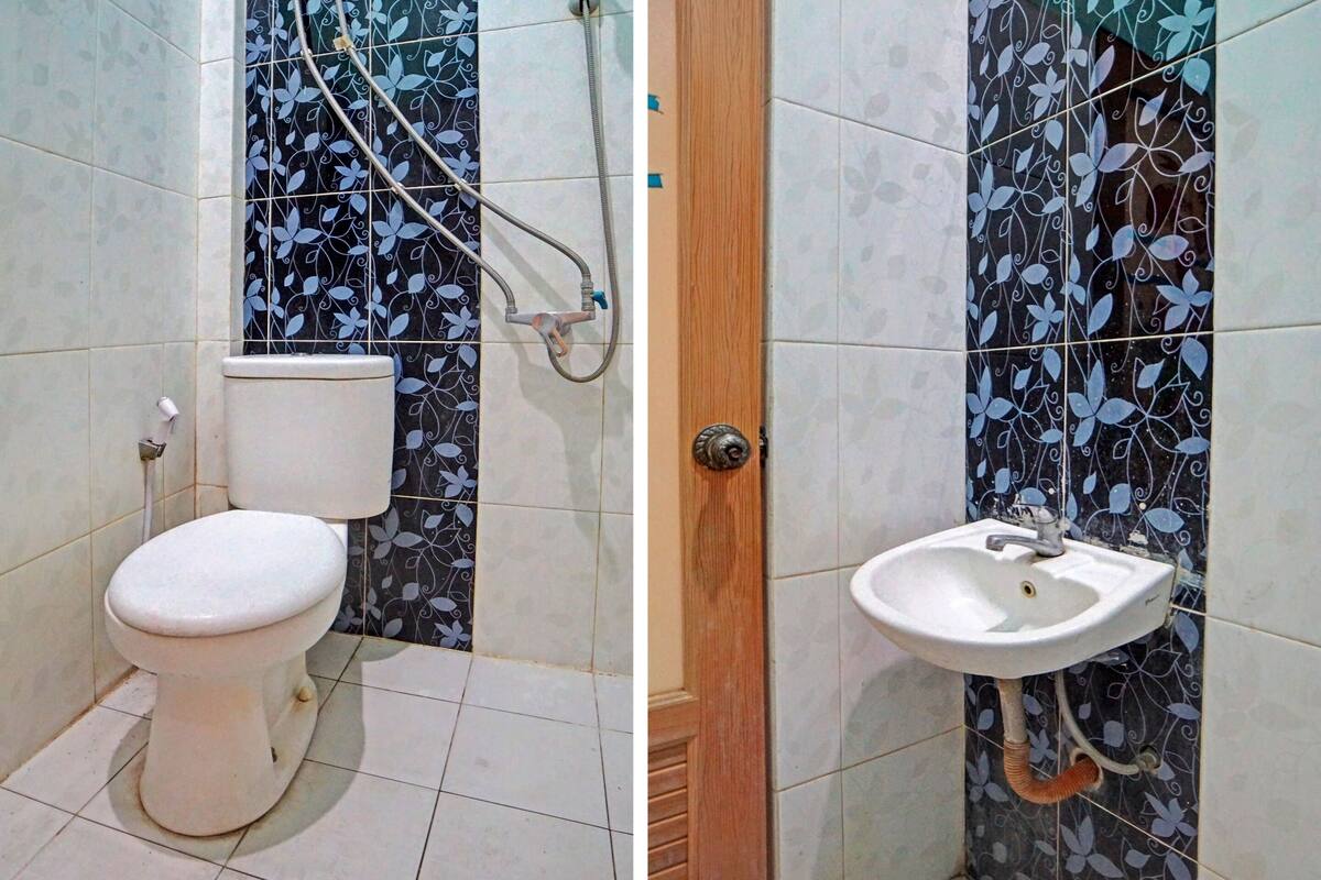 standard double room | bathroom | shower, towels, toilet paper