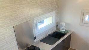 Fridge, microwave, electric kettle, cookware/dishes/utensils