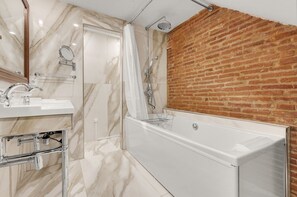 Jetted tub, hair dryer, towels, soap