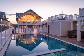 A heated pool - Island Enchantment - Oceanfront Pet Friendly Home w/ Cabana Service! FlexStay! Incredible Views, Poolside Tiki Bar, Hot Tub, and More! (Kill Devil Hills)