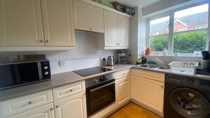 Appartamento, letti multipli | Cucina privata | Frigorifero, microonde, forno, piano cottura