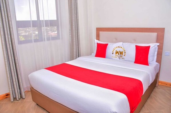 Desk, laptop workspace, free WiFi, bed sheets