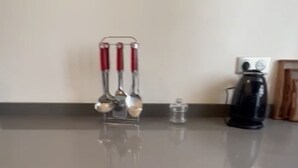A kitchen counter with a coffee maker, a glass container, and a set of utensils. - 2 Bed Apartment - Balcony, Parking, Wifi (Casablanca)