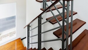 A multi-level interior with a staircase, a window with a view, and a plant. - Trixie Town House 2 With Private Pool (Rawai)