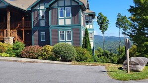 A large, two-story house with a prominent porch and multiple windows.