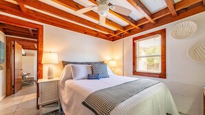 A bedroom with a bed, bedside lamps, a window with blinds, and a ceiling fan. - Oh So Sandy! - Southern Shores, Historic Flat Top, 100 Yds to Beach, Pets OK, Flex Stays (Southern Shores)