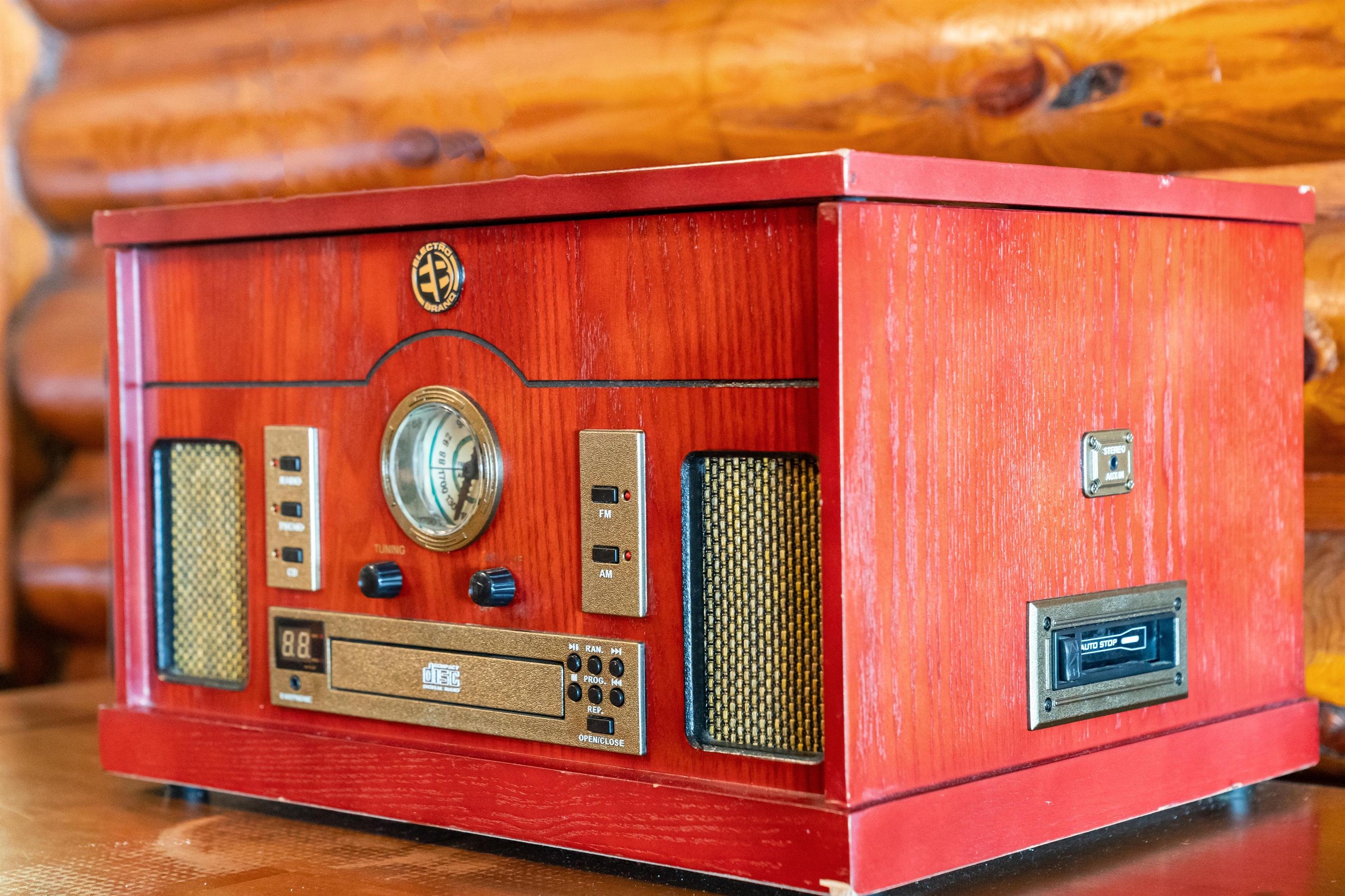 A vintage radio with tuning knobs, frequency indicators, and a speaker grille.