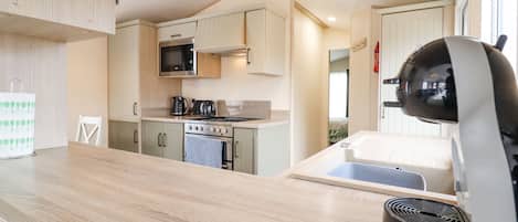 Fridge, electric kettle, toaster, cookware/dishes/utensils