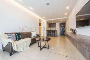 Suite Exécutive, 1 chambre, balcon | Coin séjour