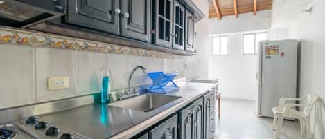Fridge, microwave, cookware/dishes/utensils, spices