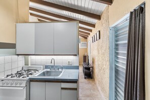 Condo, 1 Bedroom | Private kitchen | Fridge, oven, coffee/tea maker, toaster - Caribbean View Style 1 Bedroom Condo by RedAwning (Christiansted)