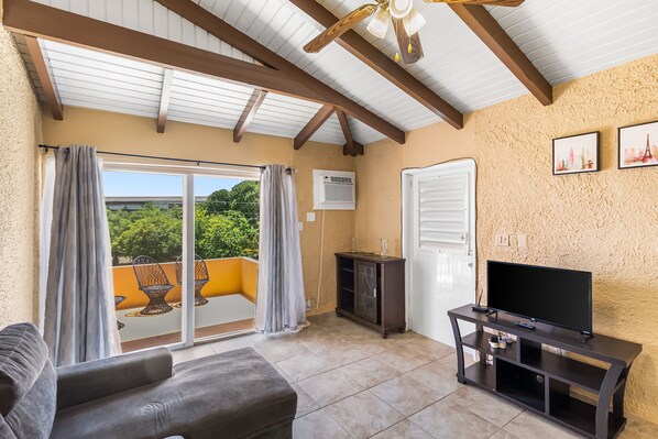 Condo, 1 Bedroom | Living area | Smart TV - Caribbean View Style 1 Bedroom Condo by RedAwning (Christiansted)