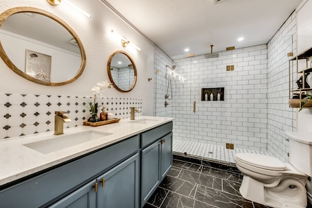 Hair dryer, towels, soap, shampoo. Afar Modern Vacation Home