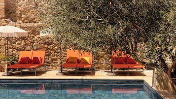 Seasonal outdoor pool, open 10:00 AM to 8:00 PM, pool umbrellas