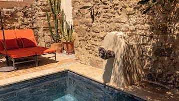 Seasonal outdoor pool, open 10:00 AM to 8:00 PM, pool umbrellas