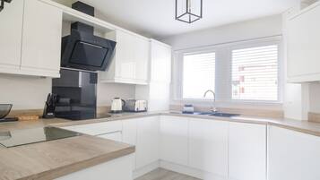 Fridge, electric kettle, toaster, cookware/dishes/utensils