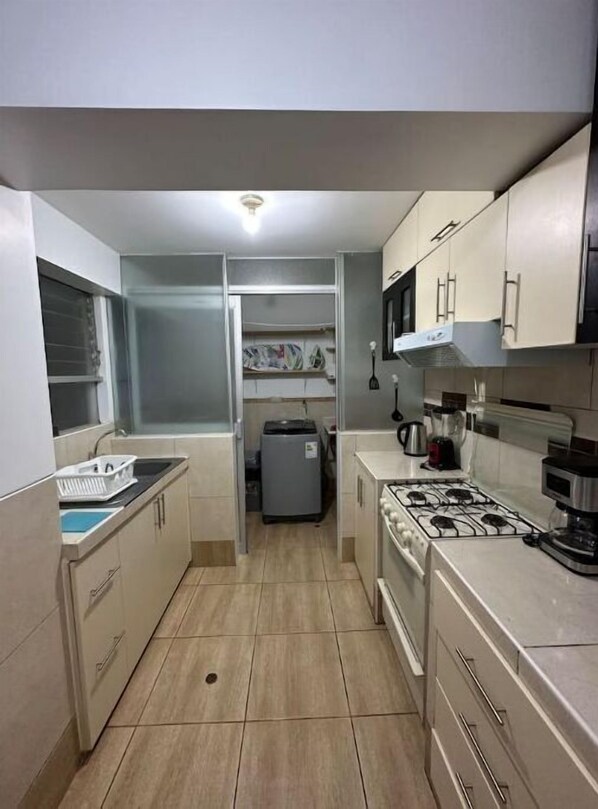 Fridge, microwave, stovetop, coffee/tea maker
