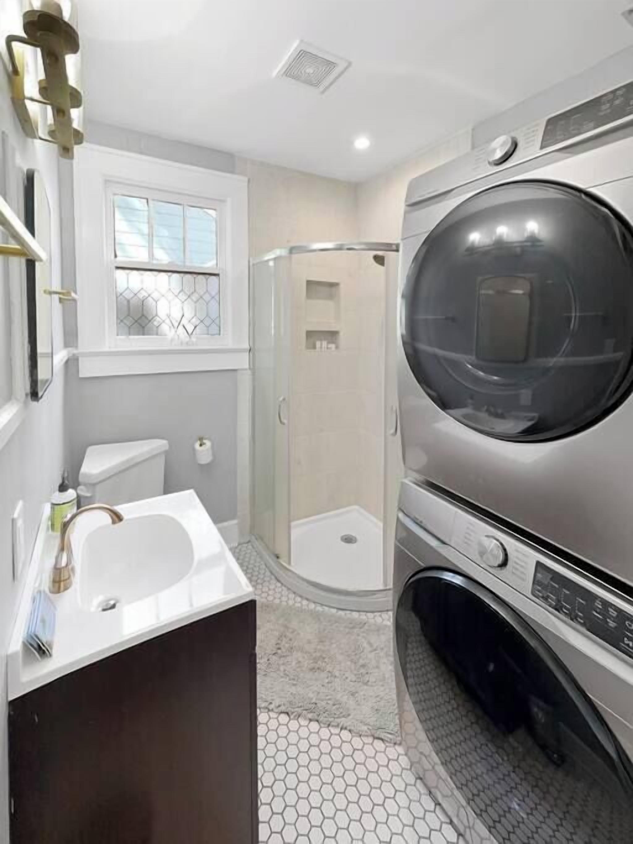 Shower, hair dryer, towels, shampoo