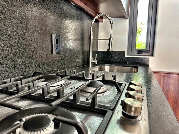 Fridge, microwave, stovetop, coffee/tea maker