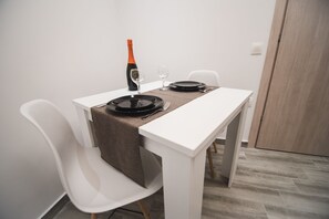 City Apartment | Living area | 32-inch LCD TV with cable channels - Contemporary Studios Historic Center (Corfu)