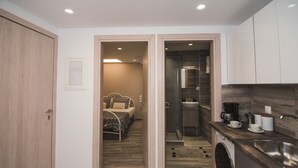 A compact apartment with a bedroom, bathroom, and kitchenette. - Contemporary Studios Historic Center (Corfu)