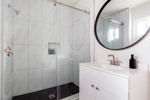 Shower, hair dryer, towels, soap
