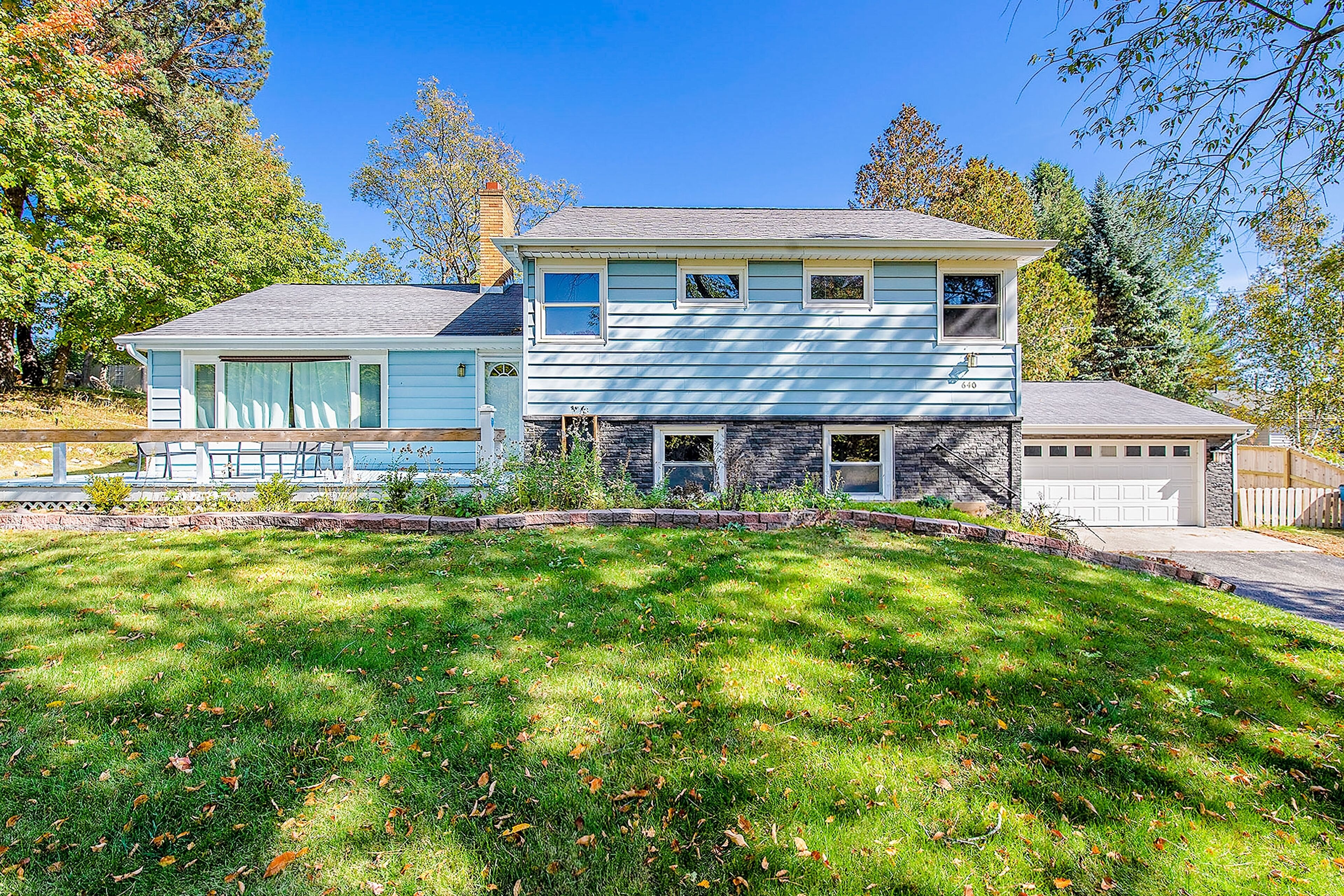 Comfortable home in a great location with enclosed yard, family room, & kayaks
