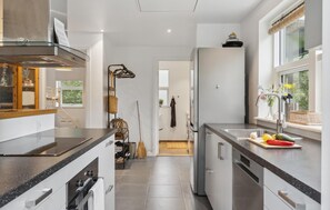 Fridge, stovetop, dishwasher, coffee/tea maker