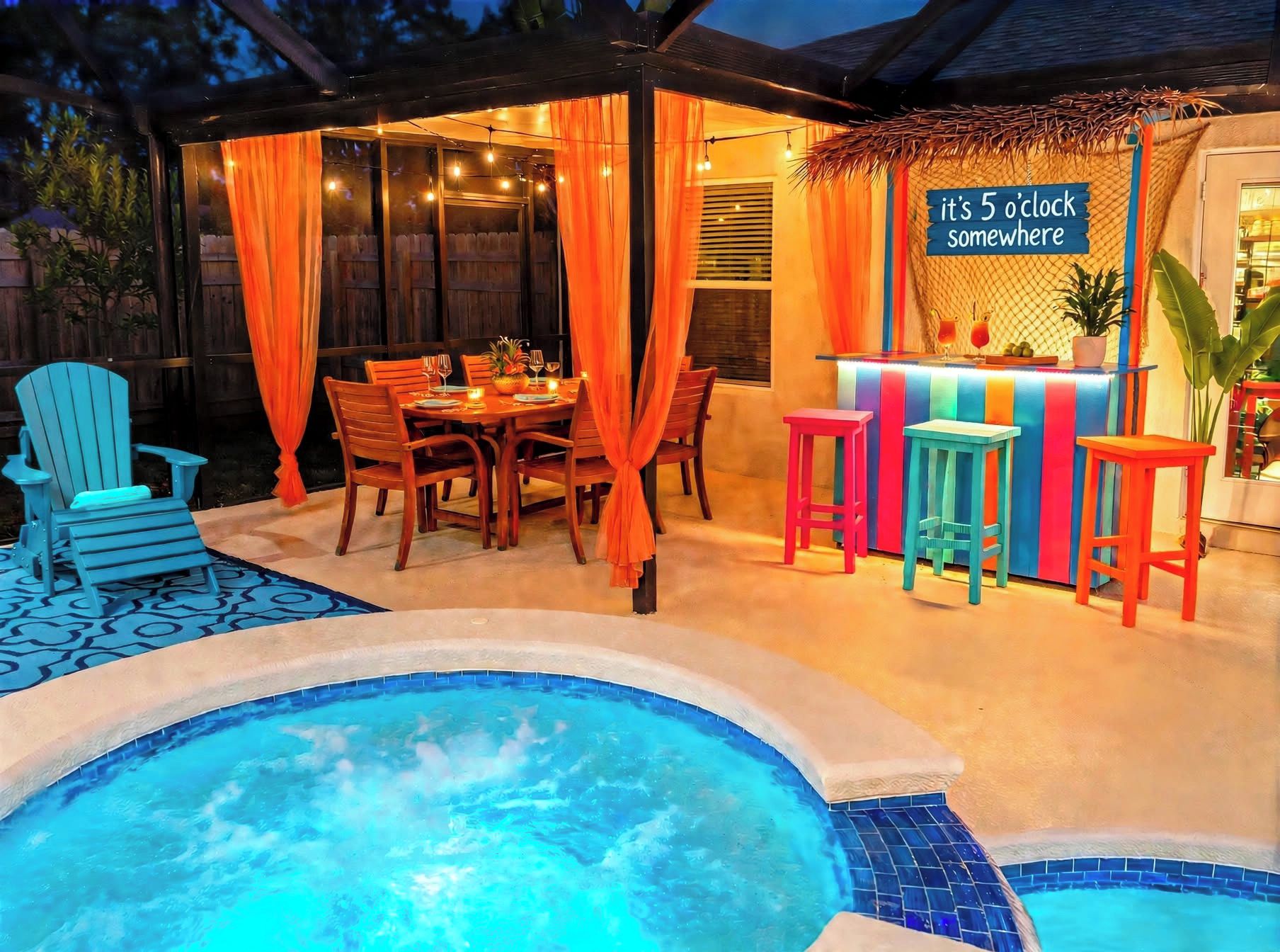 A poolside area with a hot tub, a dining table with chairs, and a bar area with stools.