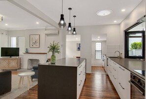 Fridge, microwave, oven, stovetop - Modern family home in a leafy riverside suburb  (Graceville)