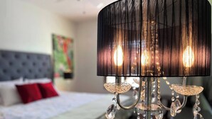 A chandelier with crystal details in a hotel room. - Pool Paradise with hot tub, bikes, every beach need, games and more! (Cocoa Beach)