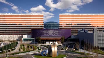 Experience the unique blend of glass and metal architecture at this modern complex, featuring a striking dome-like structure and beautifully landscaped gardens.