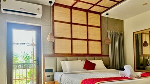 A hotel room with a bed, a window, a door, and an air conditioning unit. - Hotel Castle Manor (Vanur)