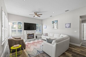 Smart TV, fireplace, books, printers