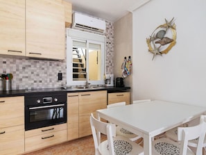 Microwave, dishwasher, dining tables