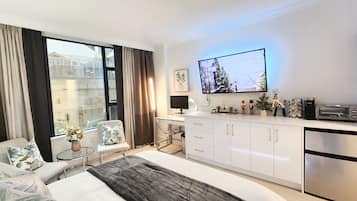 1 bedroom, desk, iron/ironing board, travel crib