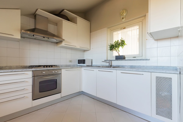 Panoramic Apartment (Via Rivoli 2) | Private kitchen | Fridge, microwave, stovetop, dishwasher