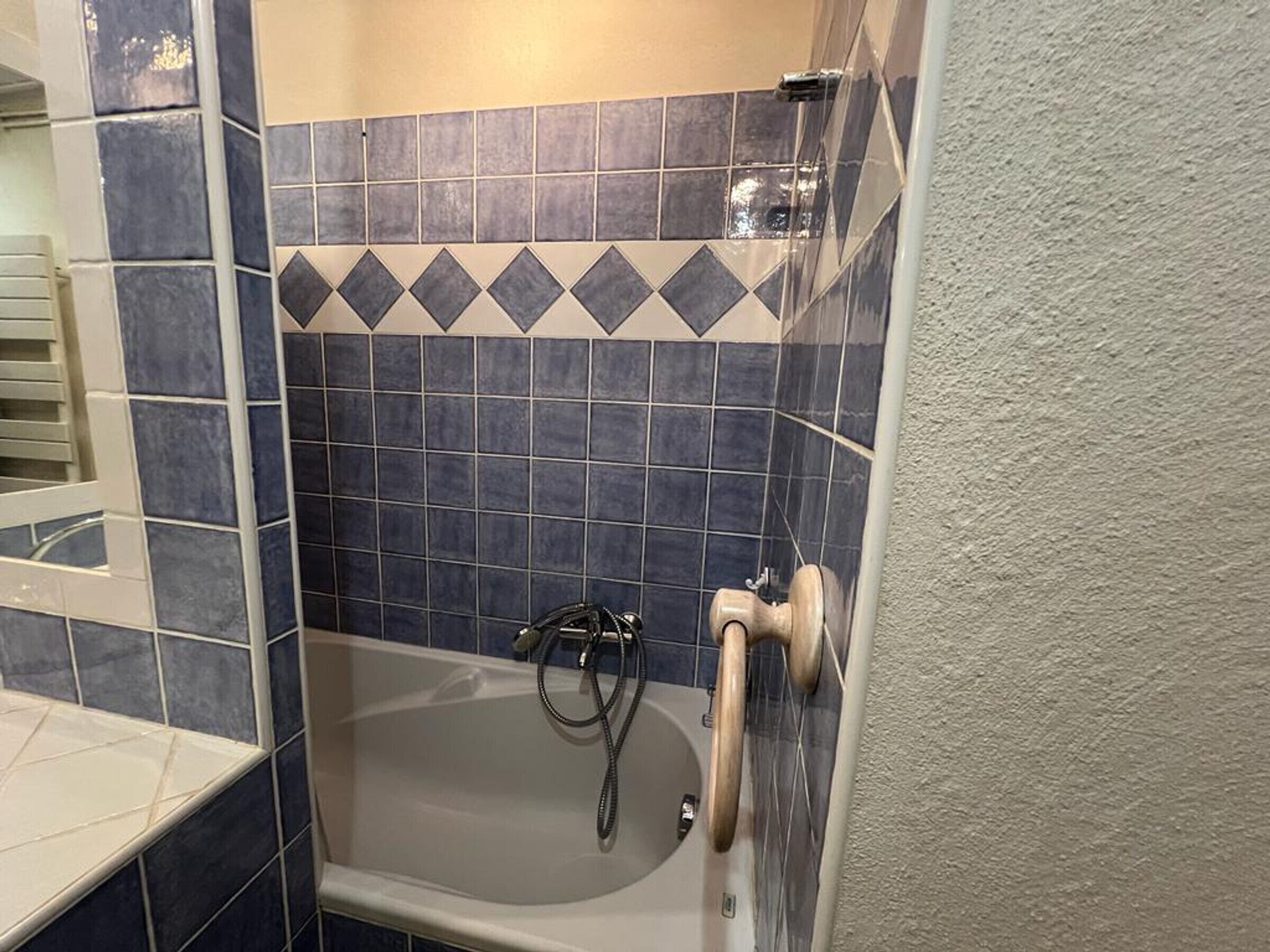A bathroom with a bathtub, a shower, and a toilet.
