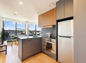 Apartment | Private kitchen | Full-size fridge, microwave, oven, stovetop - Bright And Modern Apartment On K Road! (Auckland)