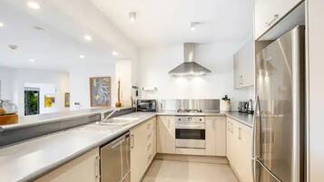 Villa | Private kitchen | Full-size fridge, stovetop, dishwasher, electric kettle
