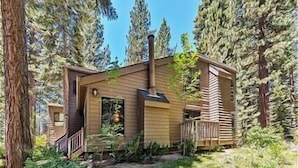 A cabin with a wooden exterior, a chimney, and a deck. - 45 Coeur Du Lac 3BR/2BA Incline Village, Pool & Mtn View (Incline Village)