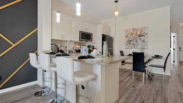 Villa | Private kitchen | Fridge, microwave, oven, stovetop