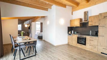 Penthouse, 1 Bedroom | Living area | Flat-screen TV, heated floors