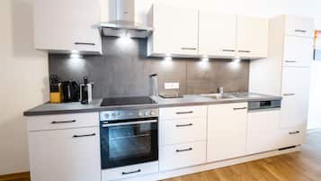 Deluxe Apartment, 3 Bedrooms | Private kitchen | Full-size fridge, microwave, oven, stovetop