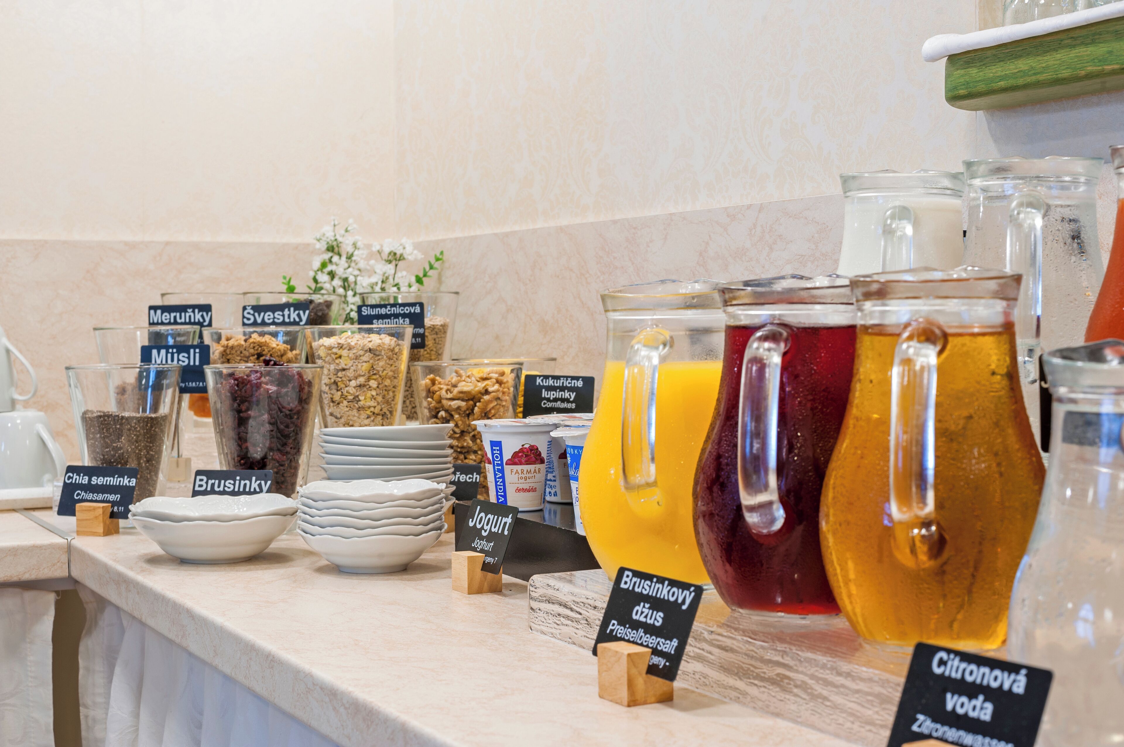 A breakfast buffet with various food items and beverages.