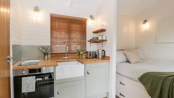 Fridge, electric kettle, toaster, cookware/dishes/utensils